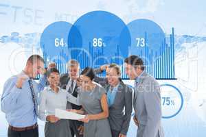 Digital composite image of business people with document celebrating success against graph