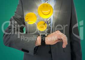 Business man mid section with watch and emojis with flares against teal background