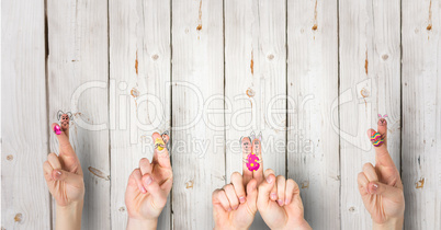 Fingers with rabbits with wood background. happy Easter.