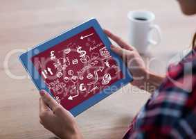 Woman with blue tablet showing white business doodles and maroon background