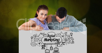 Confident woman with man looking at digital marketing icons on placard