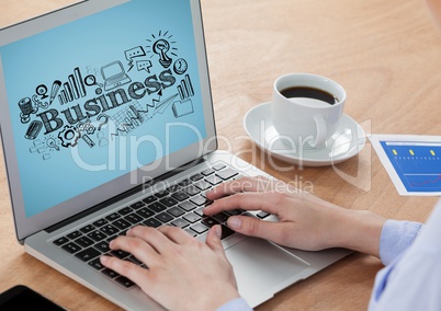 Hands on laptop with black business doodles against blue background