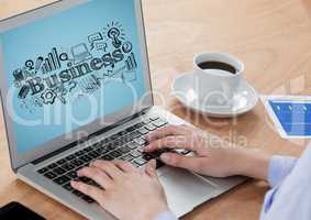 Hands on laptop with black business doodles against blue background