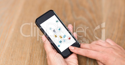 Hand using smart phones with icons on screen
