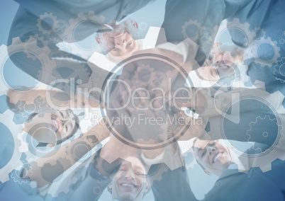 Business team putting hands together with gear graphic overlay