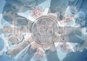 Business team putting hands together with gear graphic overlay