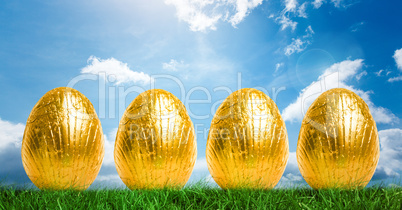 Gold Easter Eggs in front of blue sky