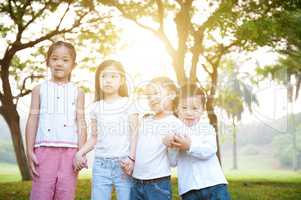 Group of Asian kids outdoor portrait.