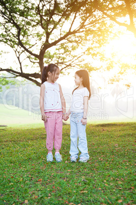 Asian sisters outdoor portrait.