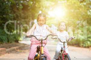 Children riding bikes outdoor.
