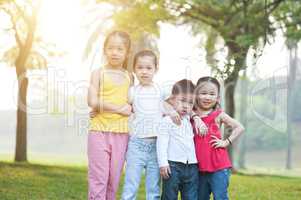 Asian children group portrait outdoors.