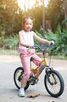 Child cycling outdoor.