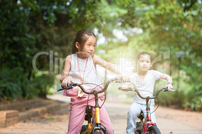 Children biking outdoor.
