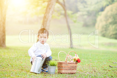 Asian boy picnic outdoors.