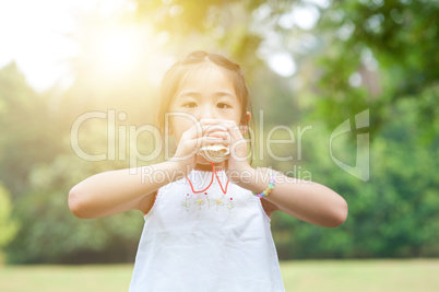 Asian little girl playing toy at outdoors.