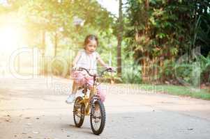 Child biking outdoor.