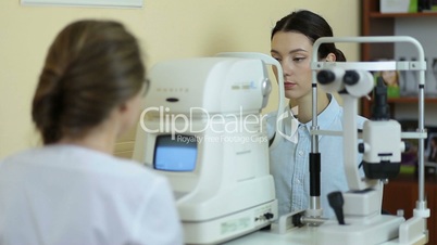 Measuring intraocular pressure of woman in clinic