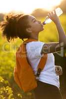 Mixed Race African American Girl Teenager Drinking Water at Suns