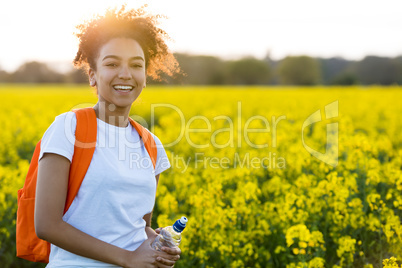 Mixed Race African American Girl Teenager In Yellow Flowers at S