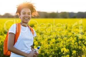 Mixed Race African American Girl Teenager In Yellow Flowers at S