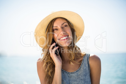 Woman smiling while talking on mobile phone