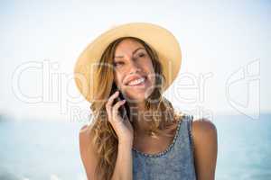 Woman smiling while talking on mobile phone