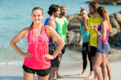 Happy friends standing on shore