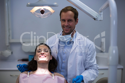 Portrait of smiling dentists and young patient