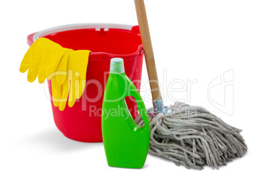 Close up of chemical bottle and mop with bucket