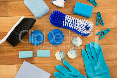 HIgh angle view of gloves and brush with clothespin