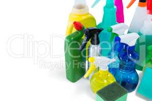 High angel view of colorful spray bottles with sponges and gloves