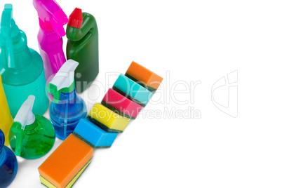 High angle view colorful sponges and spray bottles