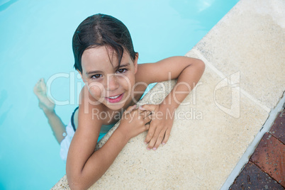 Little boy smiling in the pool