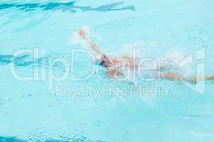 Senior man swimming in pool
