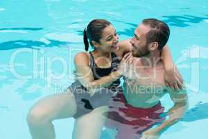 Couple embracing in swimming pool