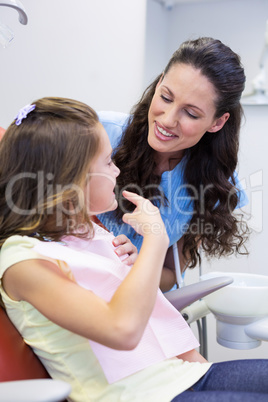 Daughter showing her teeth to mother