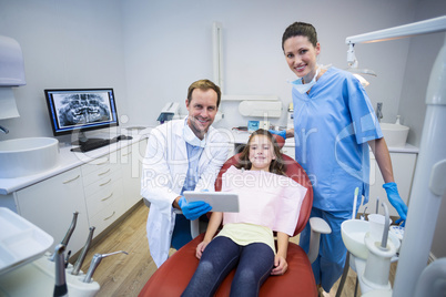 Portrait of smiling dentists and patient