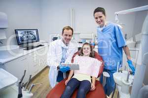Portrait of smiling dentists and patient