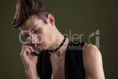 Androgynous man talking on mobile phone