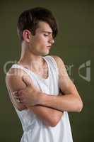 Androgynous man in waist posing with arms crossed