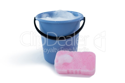 Cleaning sponge by bucket with soap sud