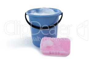 Cleaning sponge by bucket with soap sud