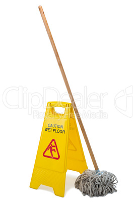 Yellow sign board with mop