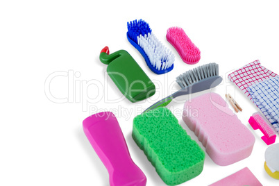 High angle view of various sponges and brushes with cleaning products