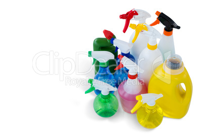 High angle view cleaning liquid in colorful spray bottles