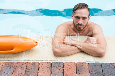 Lifeguard leaning on poolside