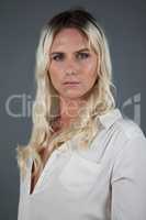 Transgender woman standing over gray background