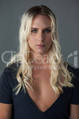 Portrait of transgender woman with long blond hair