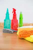 Close-up of chemical spray bottles and cleaning spone