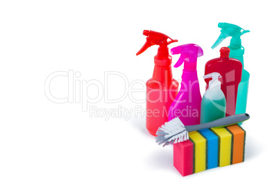 Cleaning sponges and brush with colorful spray bottles